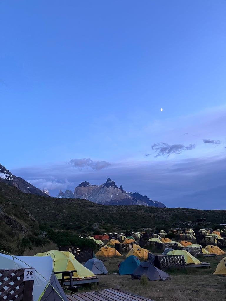 A tent pitched up in Paine Grande campsite with Cerro Cuerno Principal