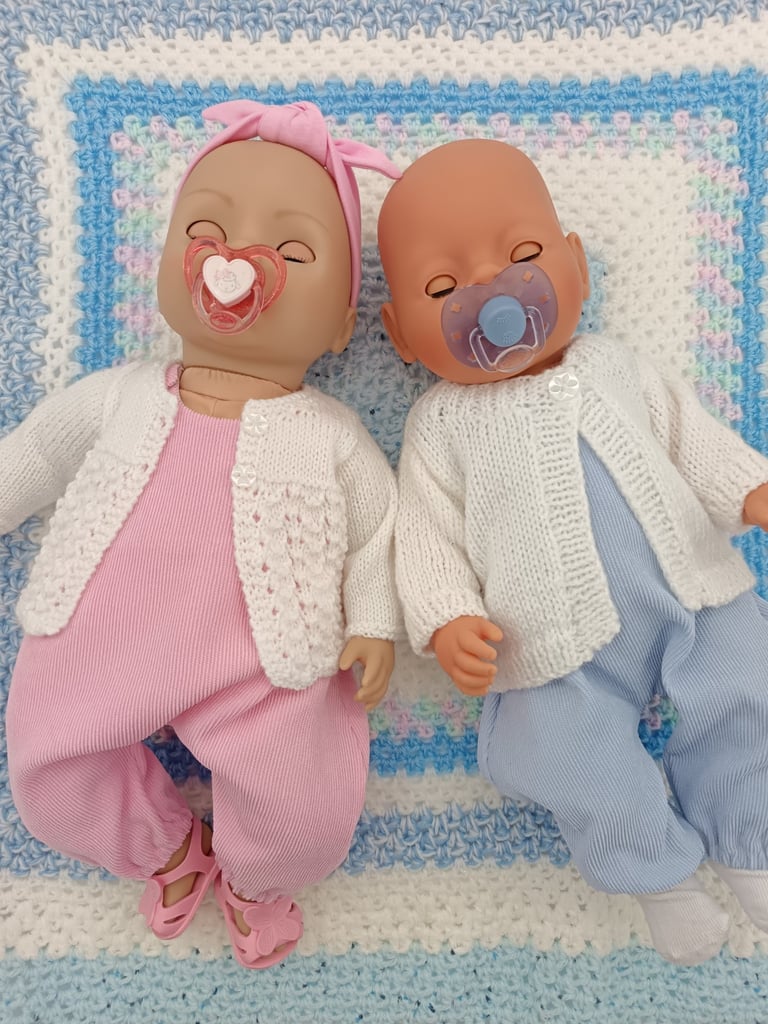 Zapf baby dolls dressed in pink and blue overalls
