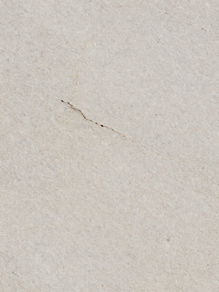 Macro texture shot of a light grey Yorkstone slab showing natural clefts and fine grain, soft overcast daylight, architectural framing, 35mm