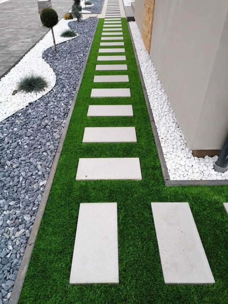 taş duvar ve çim uygulamasıyla bütünleşmiş peyzaj alanı