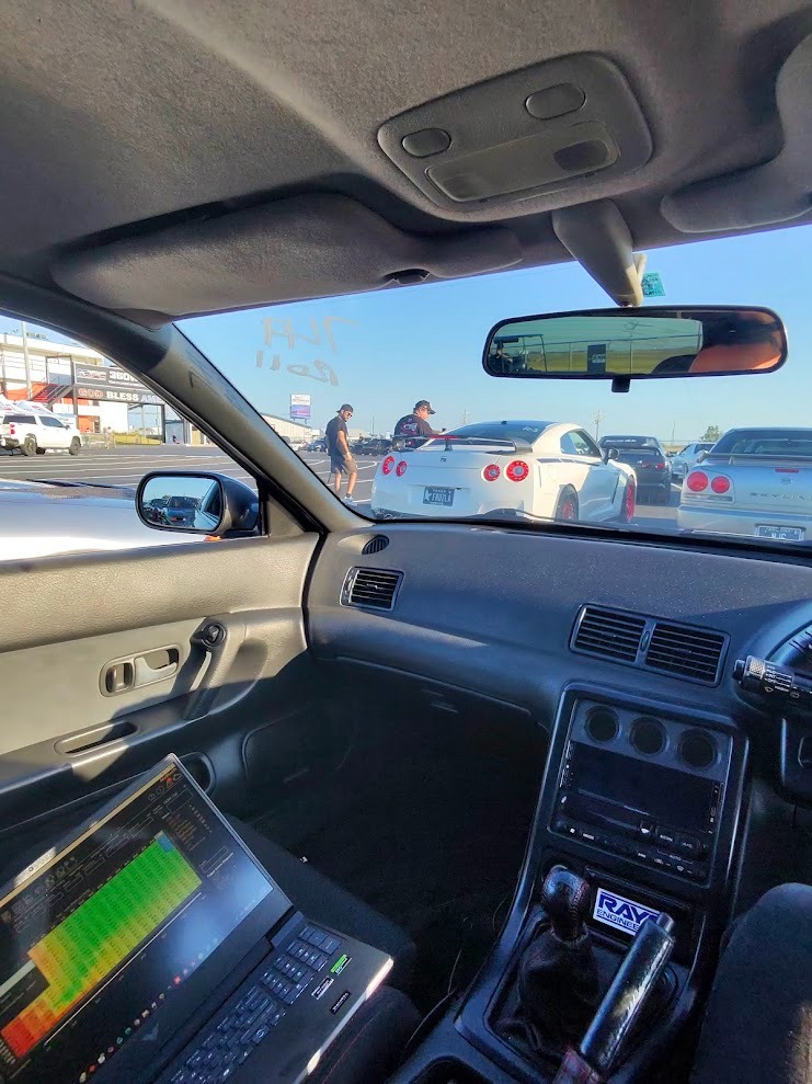 a car driving down a highway with a laptop computer