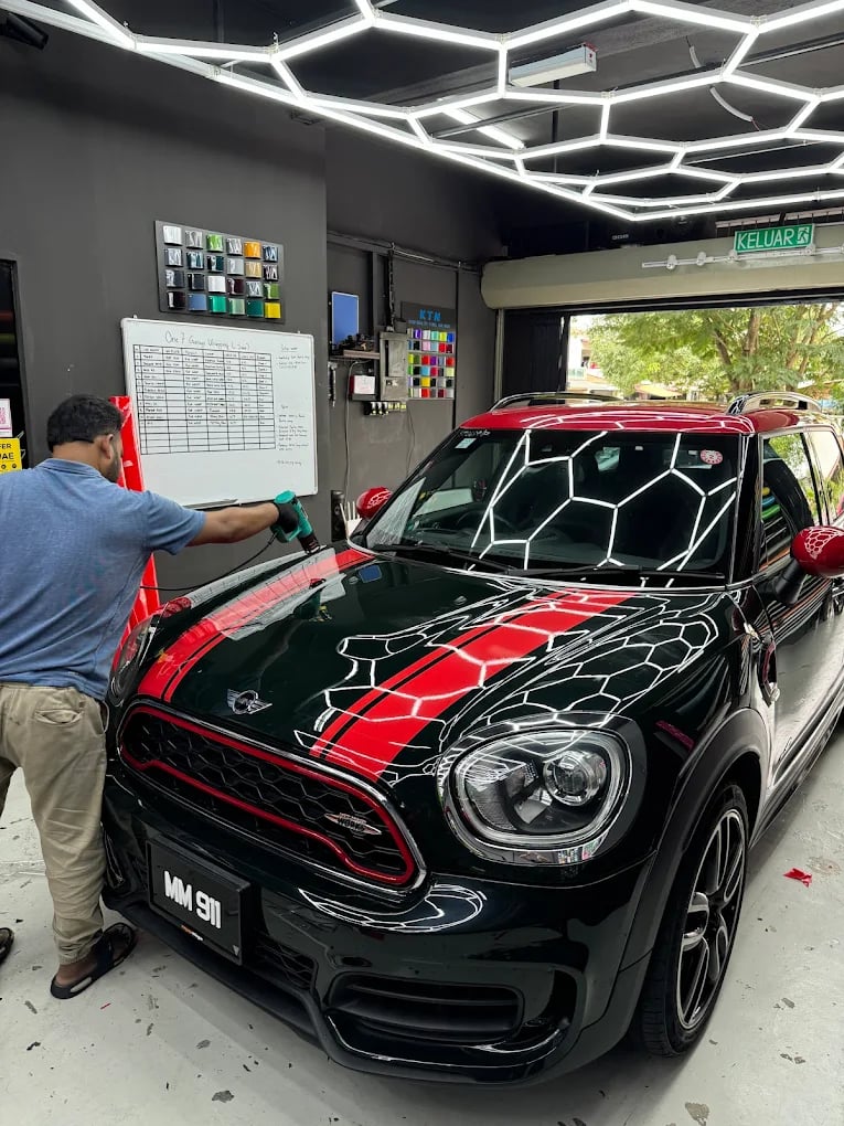 Mini Countryman wrapped in black with red racing stripe finish
