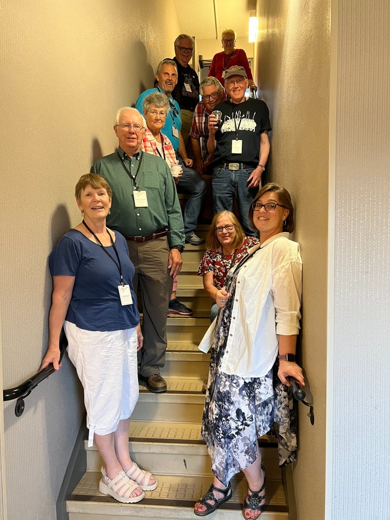 10 telelaget members stand in a stairwell