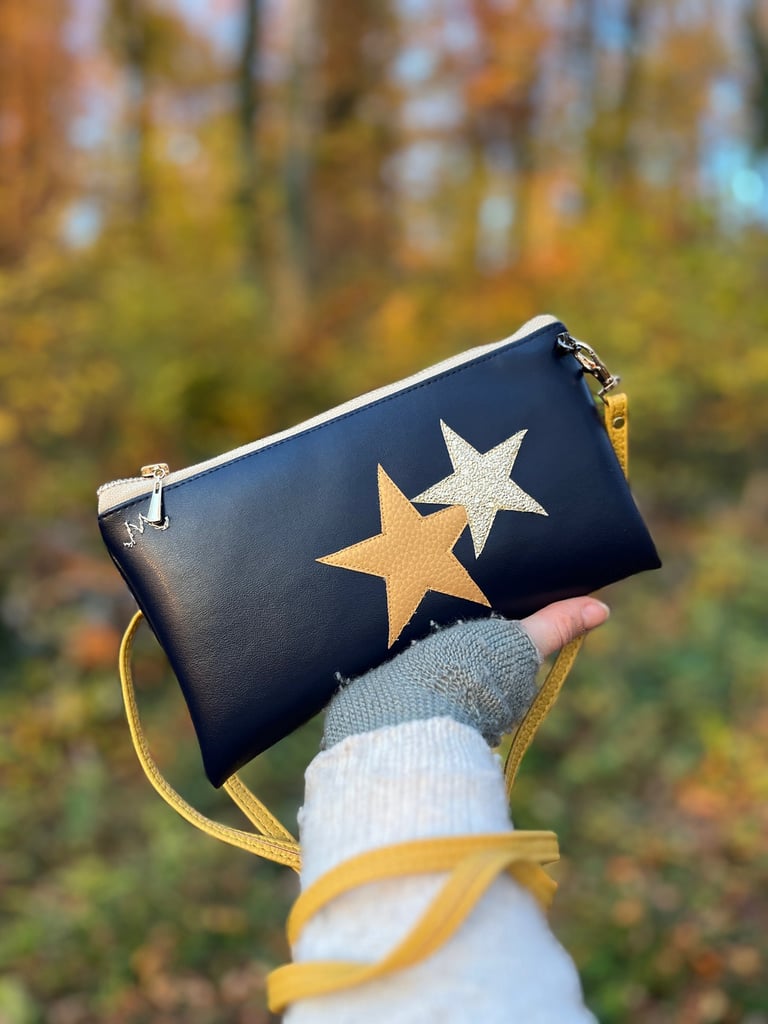 Handmade navy Cactus leather clutch bag with gold star accents