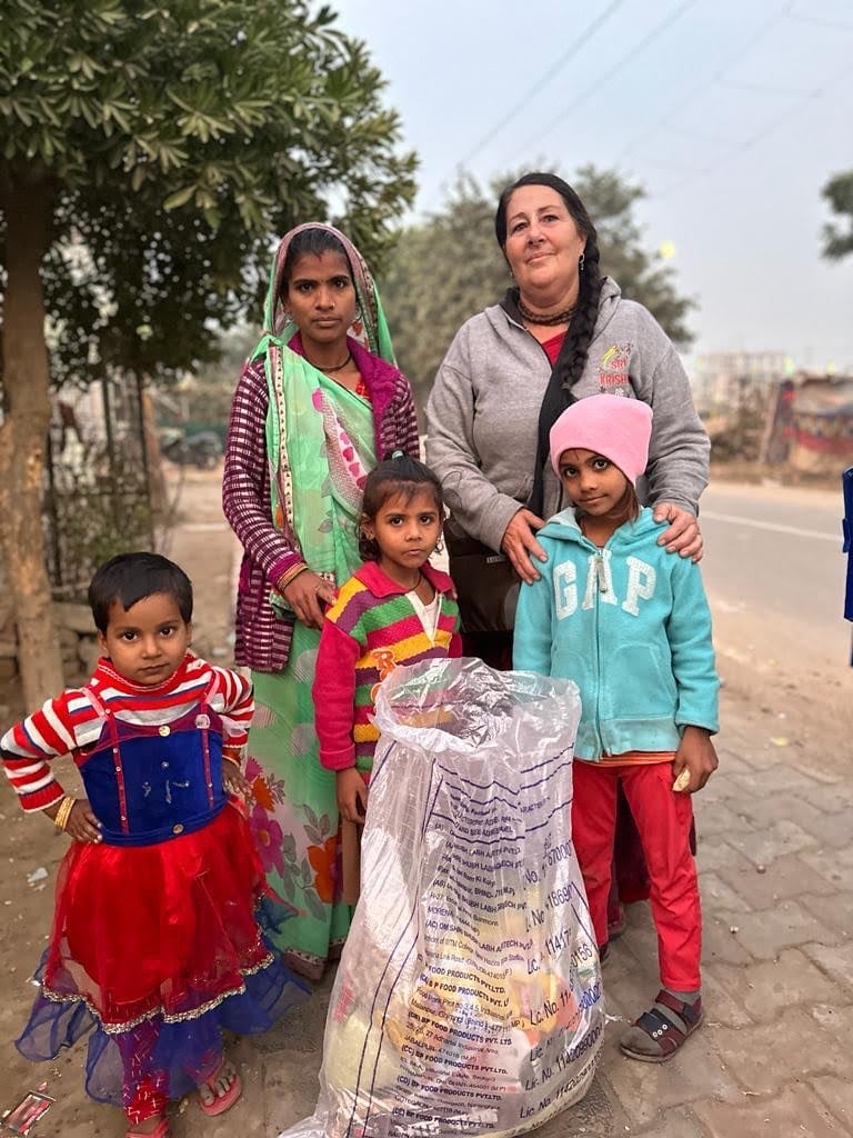 poor children accepting ration kits