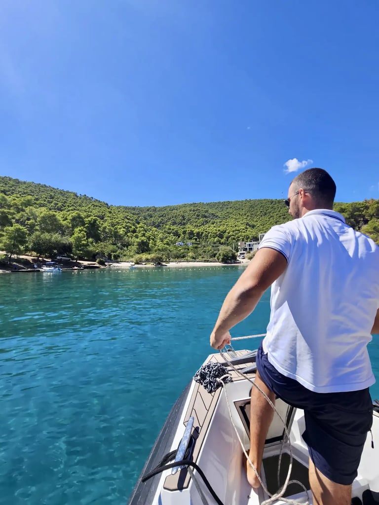 A skipper anchoring a speedboat at Krusica Bay, Solta in Croatia during a private boat tour from Split