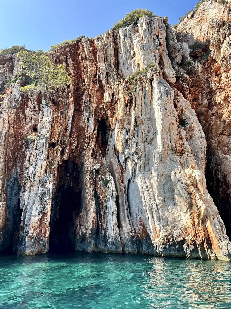 Sea level view of Red Rocks cliffs on the island of Hvar, taken during a private boat tour from Split
