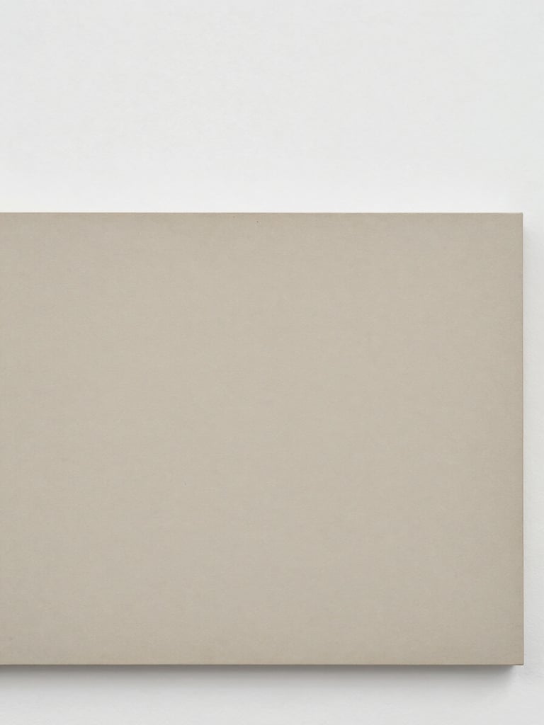 Close-up detail of the texture of an archival pigment print from the 'Industrial Scars' series, showing fine grain and subtle surface variations, under neutral gallery lighting.