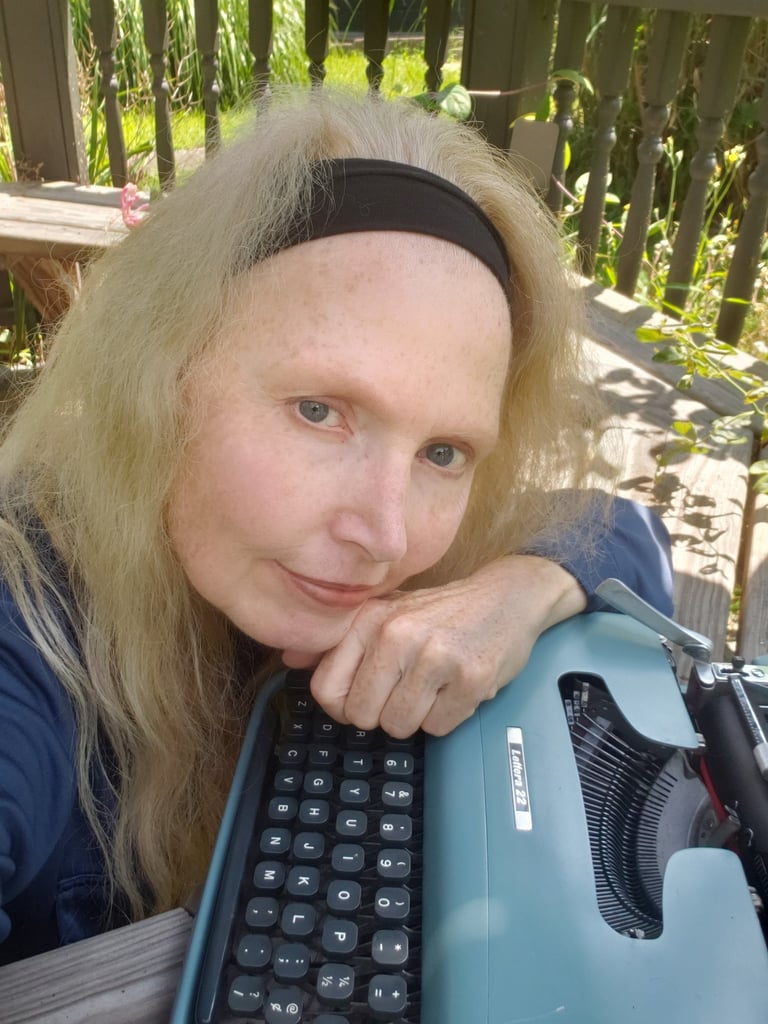 Author and acupuncturist Jean Brannon outdoors with her antique Olivetti Lettera 22 typewriter.