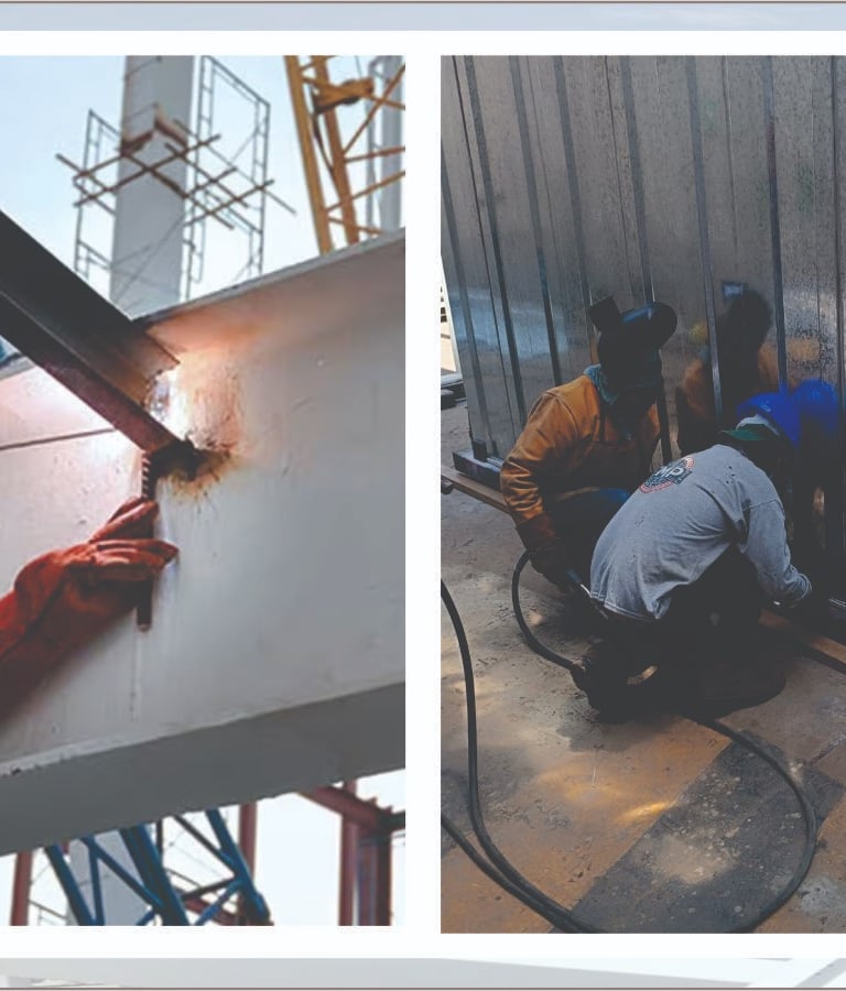 Professional welders performing industrial steel beam welding and metal wall panel installation on a construction site.