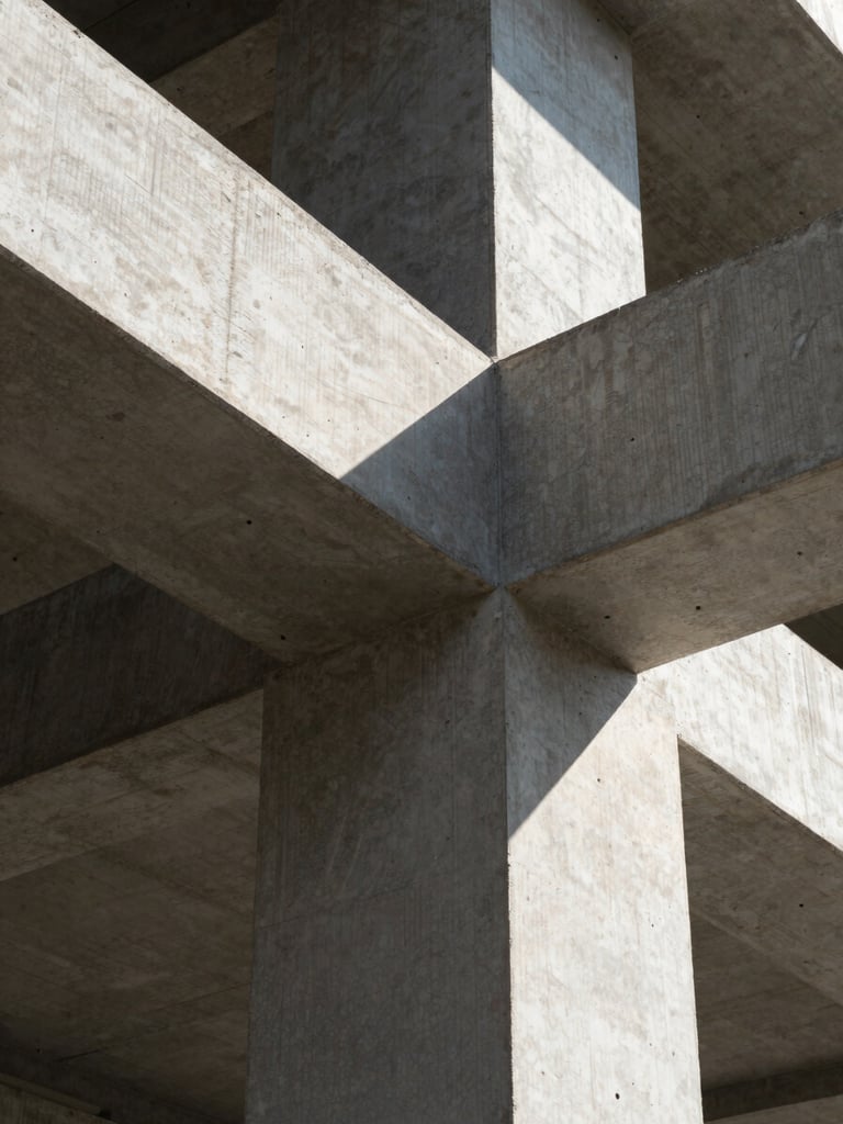 Macro close-up of modern architectural concrete texture and sharp structural steel beams under direct hard sunlight, casting deep geometric shadows.