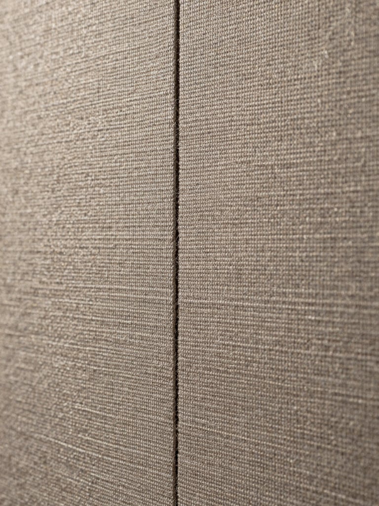 Close-up of fabric wall finish and track join
