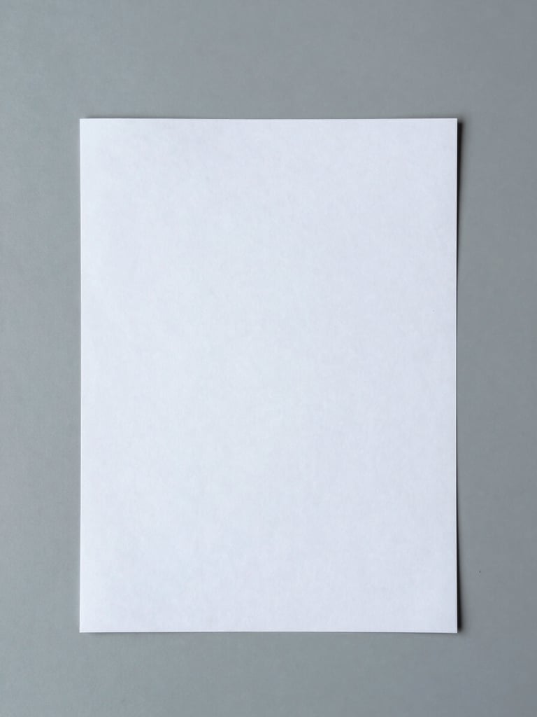 Top-down flat lay of clean editorial proofs on a cool gray desk, soft diffused daylight, minimalist workspace