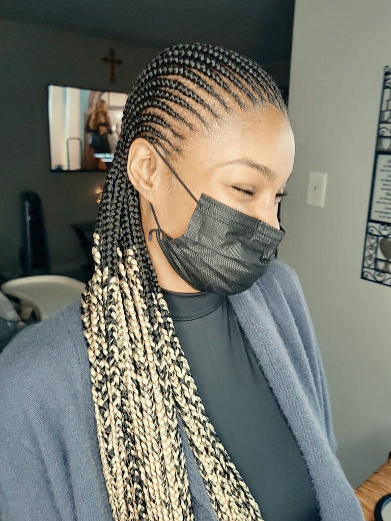 a woman with cornrows hairstyle