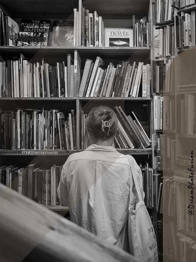 a person standing in front of a bookcase