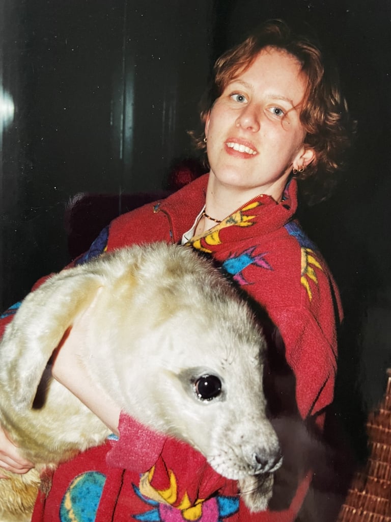 marrije verspuij holding a grey seal pup