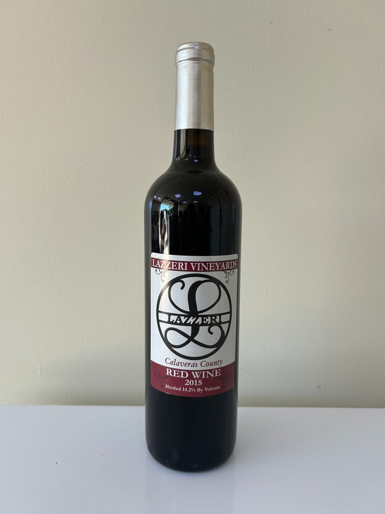 An unopened bottle of wine labeled 2015 Red Blend