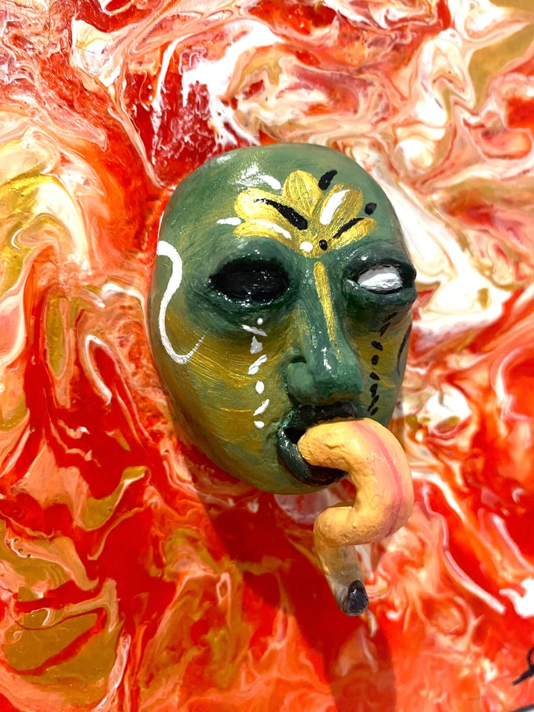 une sculpture avec une longue langue qui émerge d'un tableau rouge vu de près