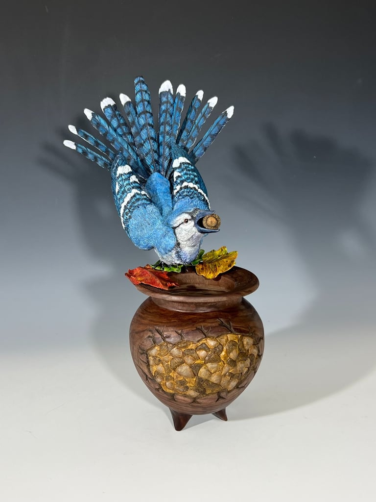 a blue bird sitting on top of a wooden bowl