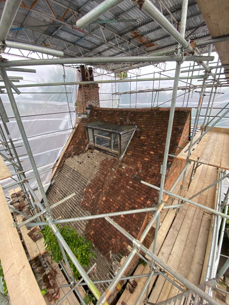 Inside a temporary roof scaffolding fully encapsulated on listed building