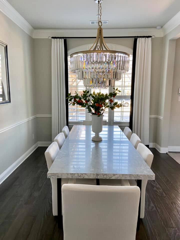 Custom French Pleated Drapery with Blalck accent band on leading edge.  Custom Black Hardware with acrylic finials Kasmir Fab