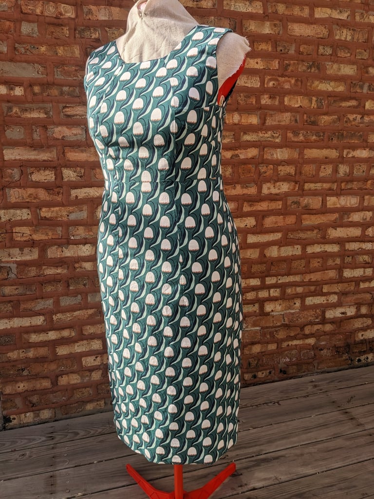 The front of a green art nouveau reversible sheath dress