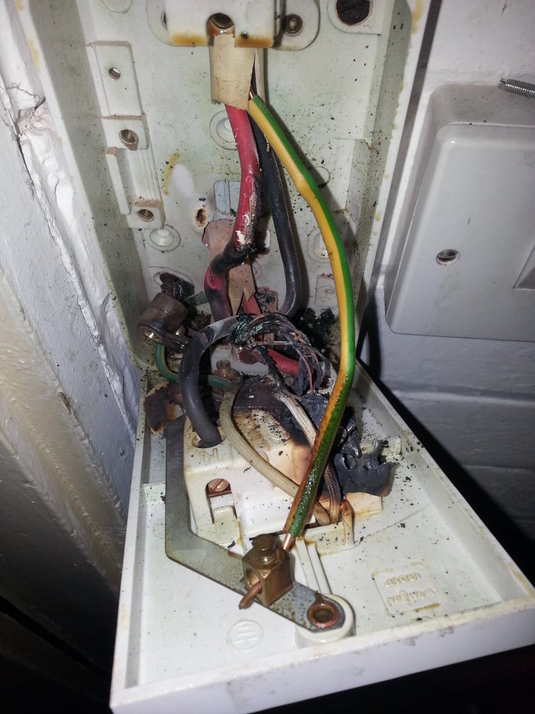 Electrical fault finding revealing heat damage inside a 45A shower isolator switch