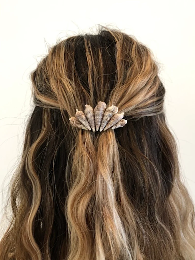 Hair clip made with shells, arranged to look like a larger "shell" shape.
