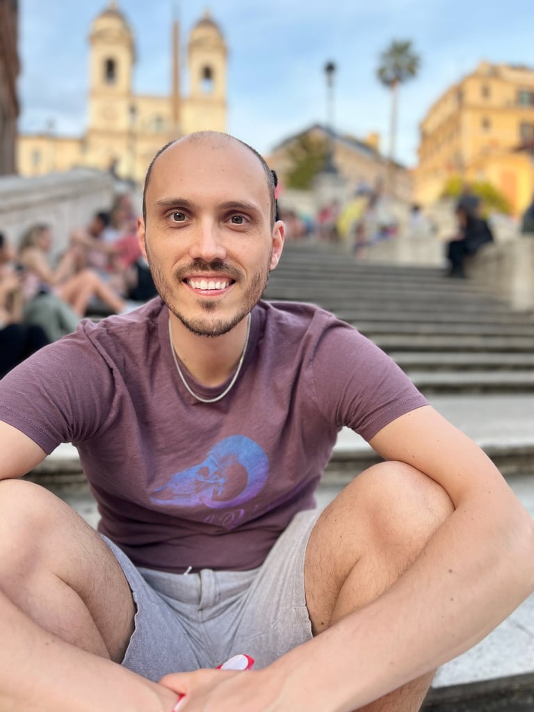 a man sitting on a staircase in front of a crowd of people