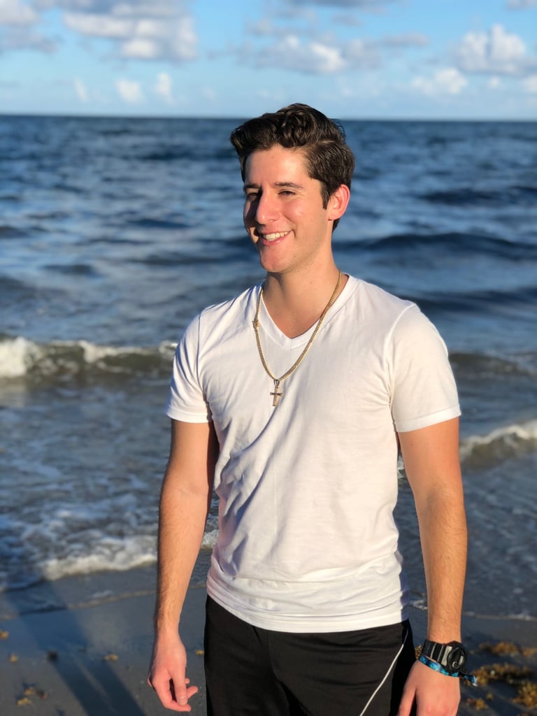 Rene Aviles in a white shirt and black pants