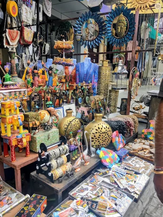 Souvenir shop in bapu bazar Udaipur displaying colorful local crafts and handmade items.