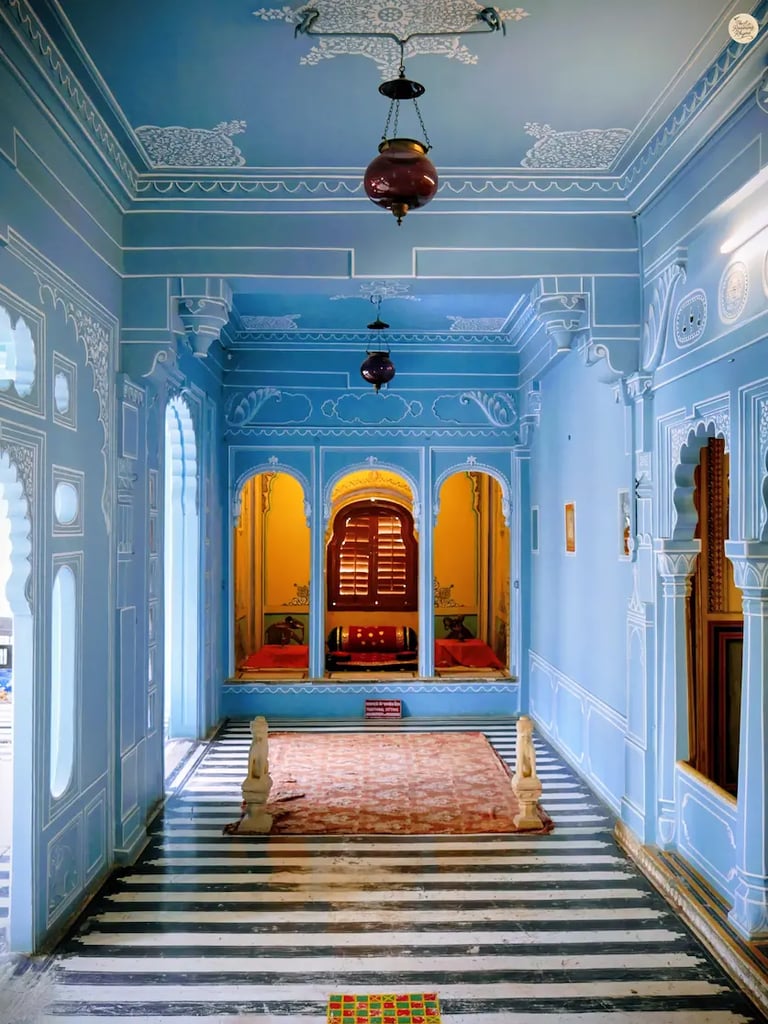 Interior of Bhim Vilas showcasing stunning aesthetic and soft blue walls, City Palace Udaipur India.