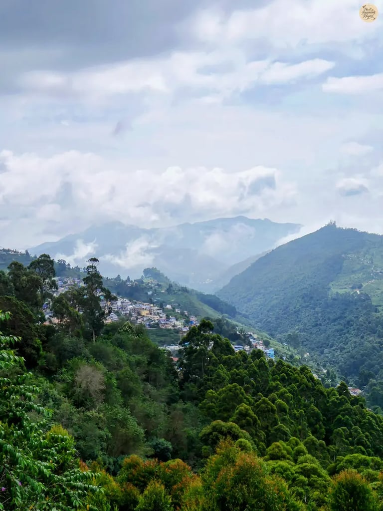 Distant view of Kodaikanal settlement shrouded in mist from Coaker’s Walk.
