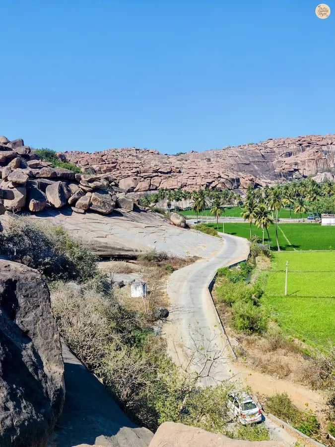 Scenic view of Kishkindha in Hampi, where rocky boulders blend with lush greenery.