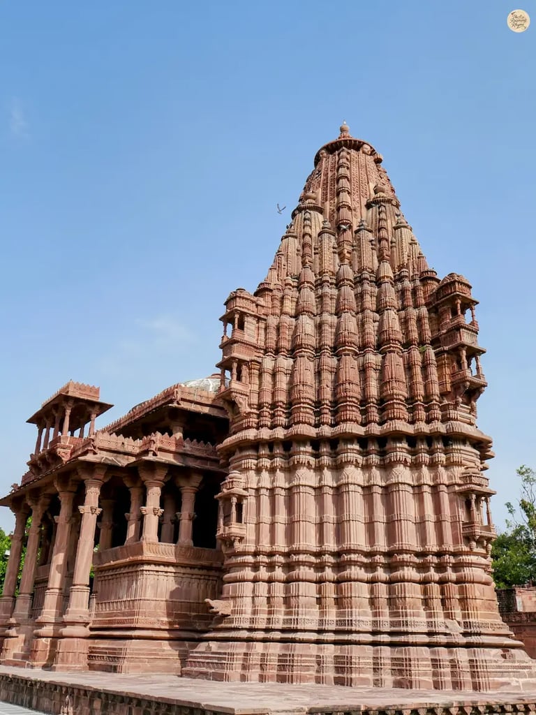 Intricate outer wall carvings of a temple in Mandore Garden Jodhpur, a glimpse into Rajasthan’s historic temple architecture.