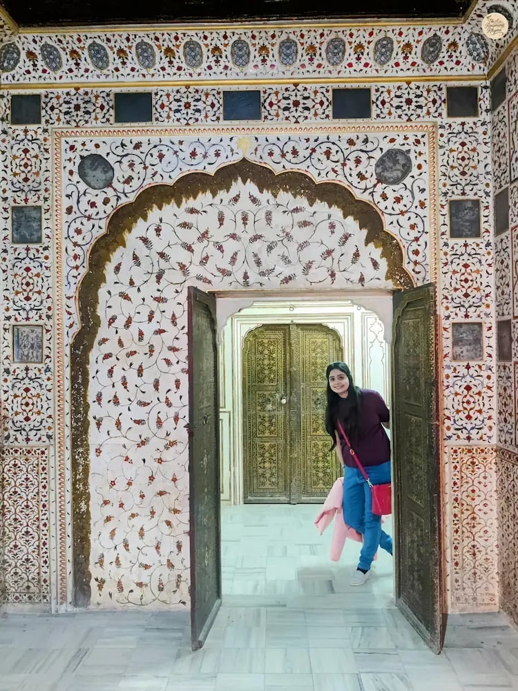 Interior of Phool Mahal in Bikaner with walls adorned in royal floral designs.
