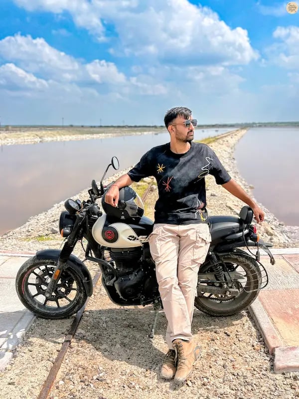 posing on a railway track stretching across Sambhar Lake’s salt pans.