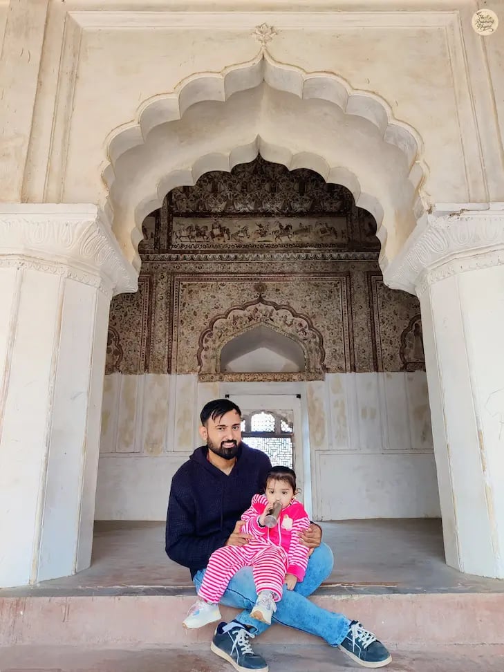 A serene moment inside the fresco-filled chambers of Raja Mahal, Orchha.