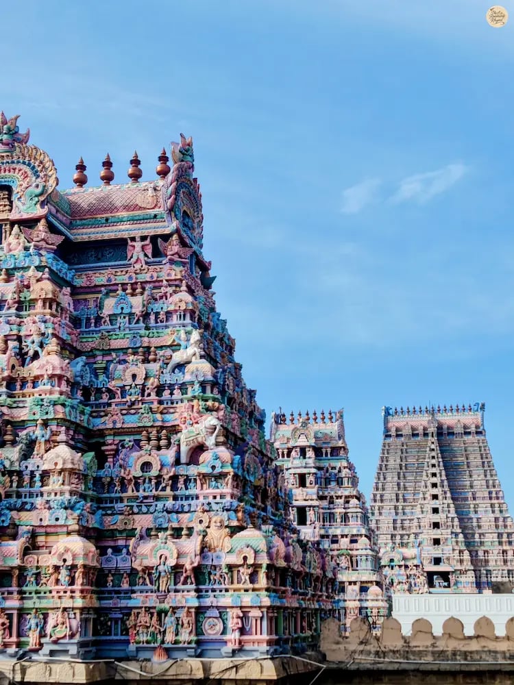 View of three temple gopurams in a row with the towering Rajagopuram of Sri Ranganathaswamy Temple, Srirangam, Tamil Nadu.