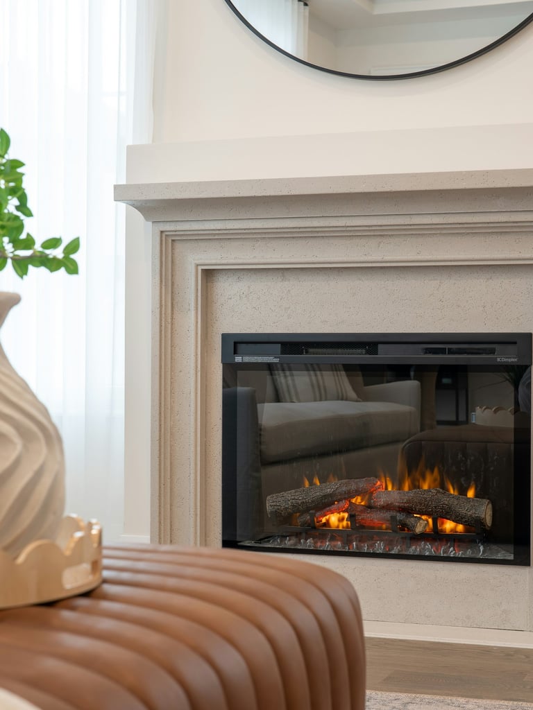luxury white stone fireplace with leather ottoman in foreground