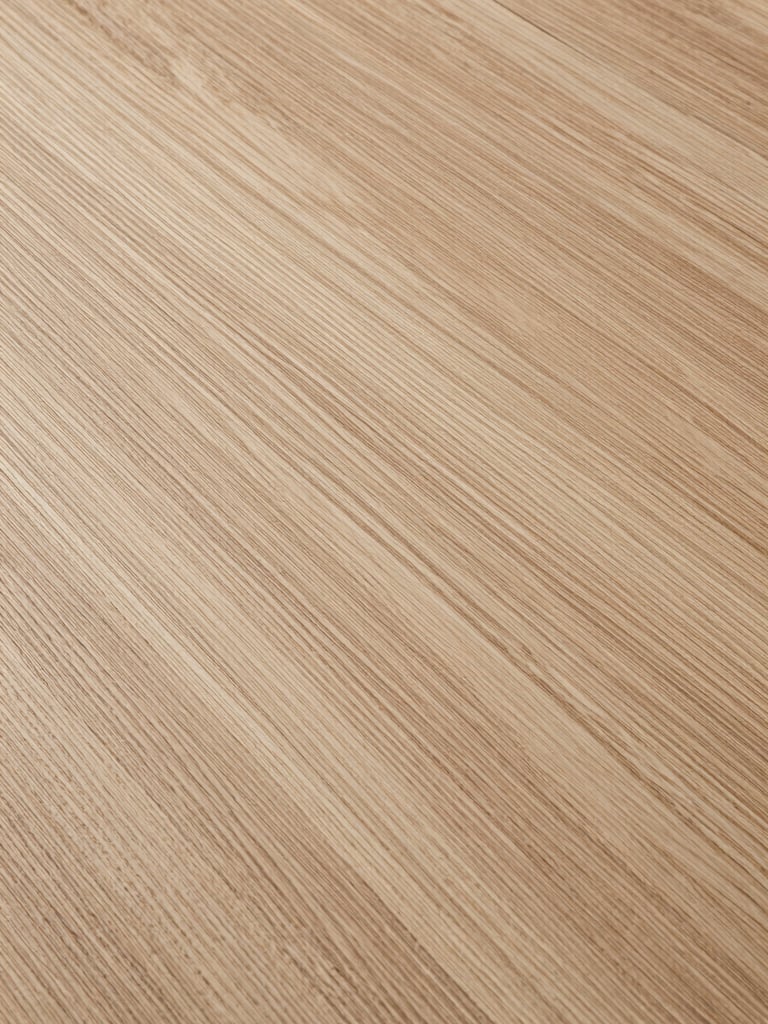 Extreme close-up of a quartersawn white oak surface under cool studio strobe, medullary rays catching light at an oblique angle, grain lines running parallel across the full frame, no hands or tools, pure material documentation