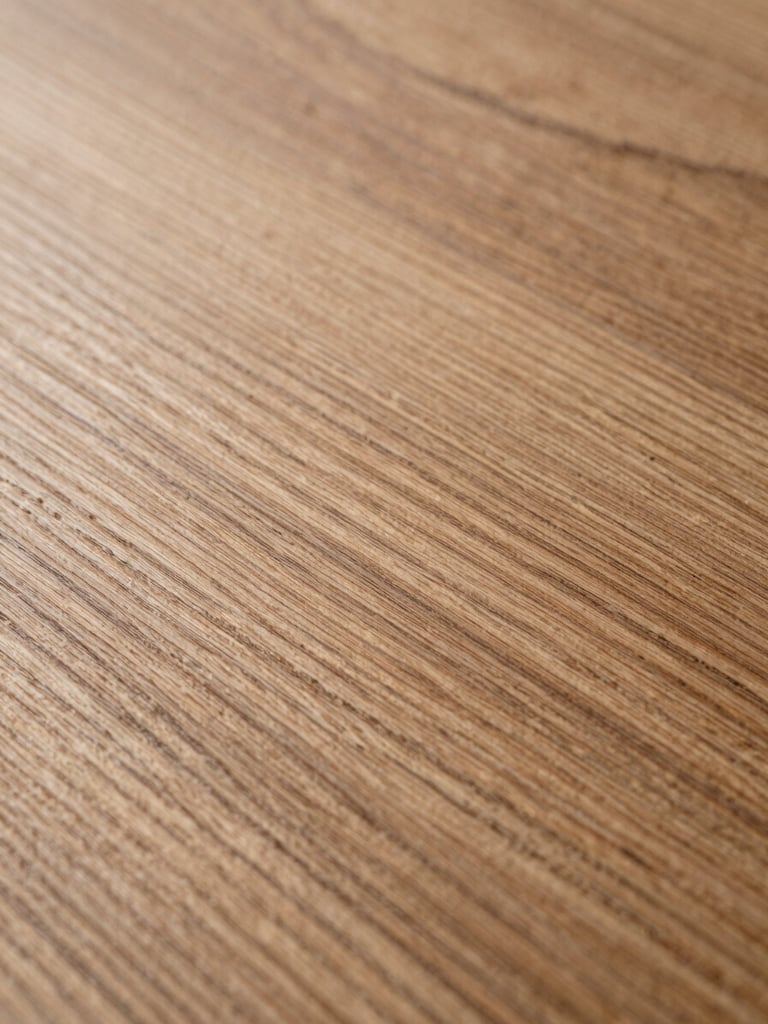 Extreme macro close-up of quarter-sawn oak grain, cool studio strobe light raking across the surface to reveal medullary rays and fine figure, full-height portrait framing, no warm filtering, grain fills the frame edge to edge