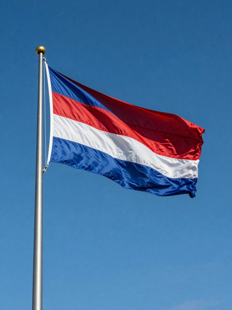 Low-angle architectural shot of a heavy-duty steel flagpole with a large flag flying proudly under intense direct daylight, deep blue sky, metallic texture of the pole visible, sharp details, 35mm