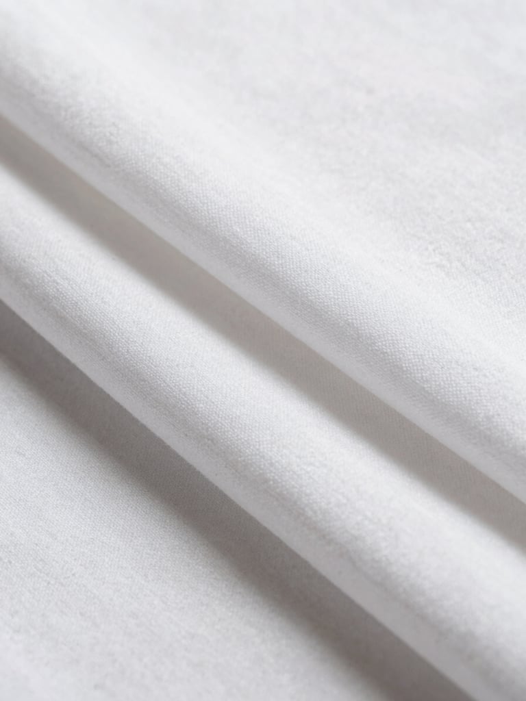Macro close-up of perfectly aligned, crisp white cotton sheets under bright, natural daylight, showing fine fabric texture, minimal composition.