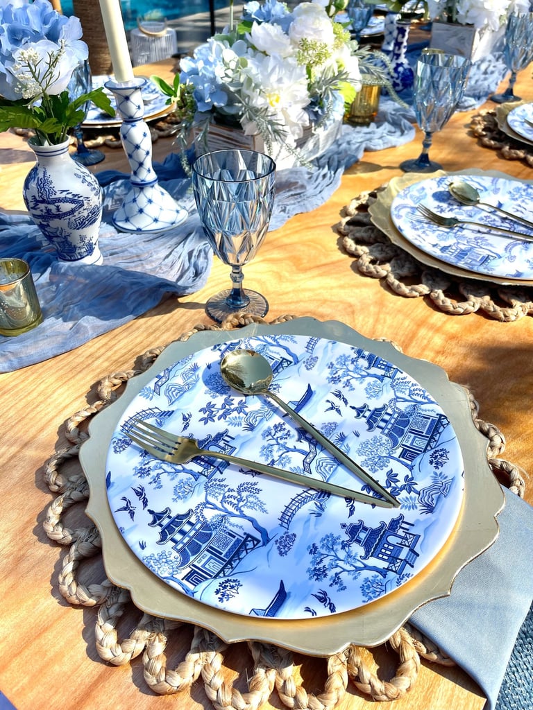 Blue Willow place setting, gold flatware, elegant outdoor luxury picnic Gathered Grace Picnic Co