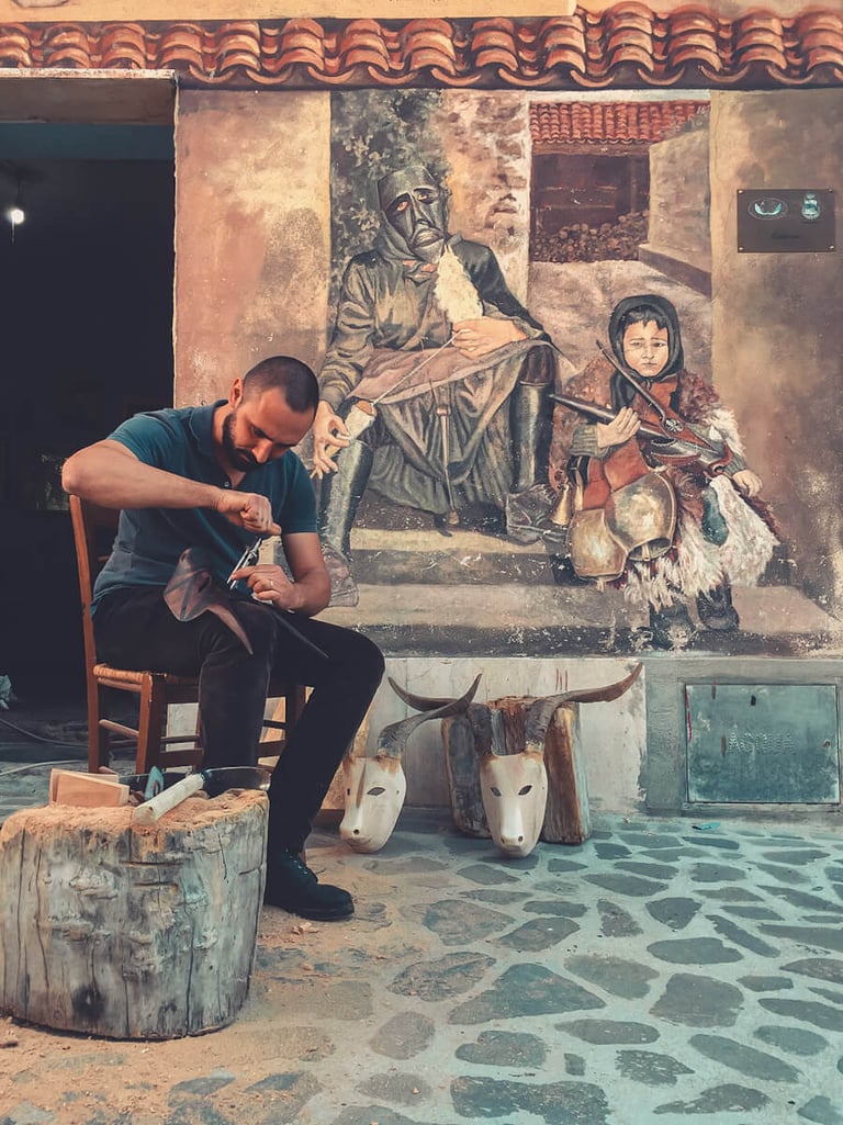 Artisan carving a traditional Boes mask in Ottana, Sardinia