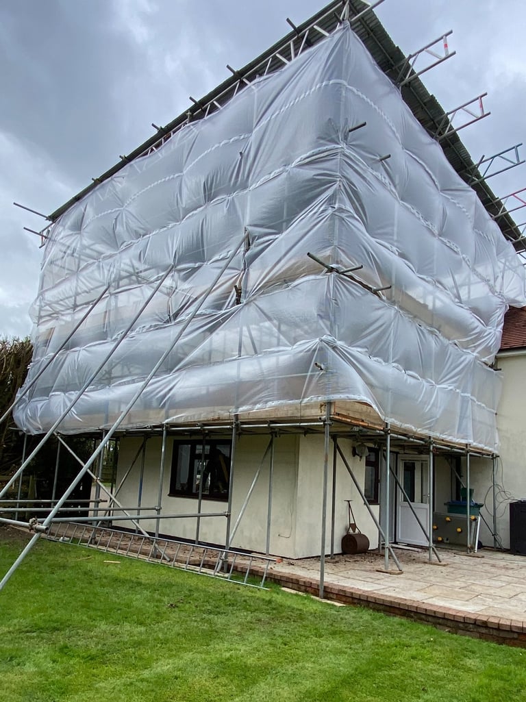 Temporary roof scaffolding covering property