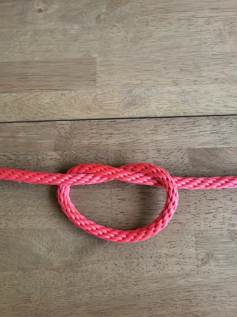 Overhand Knot tied in red rope
