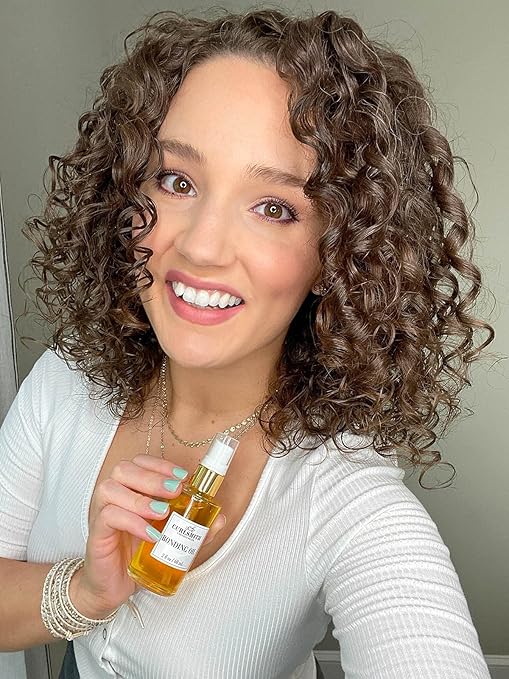 CURLSMITH Bonding Oil in a 2 fl oz bottle, a lightweight finishing oil that seals cuticles