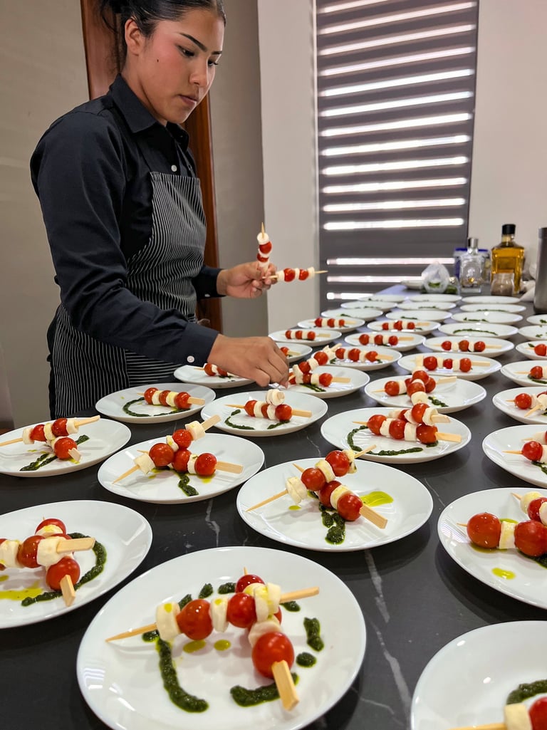 a woman in a chef's apron preparing food